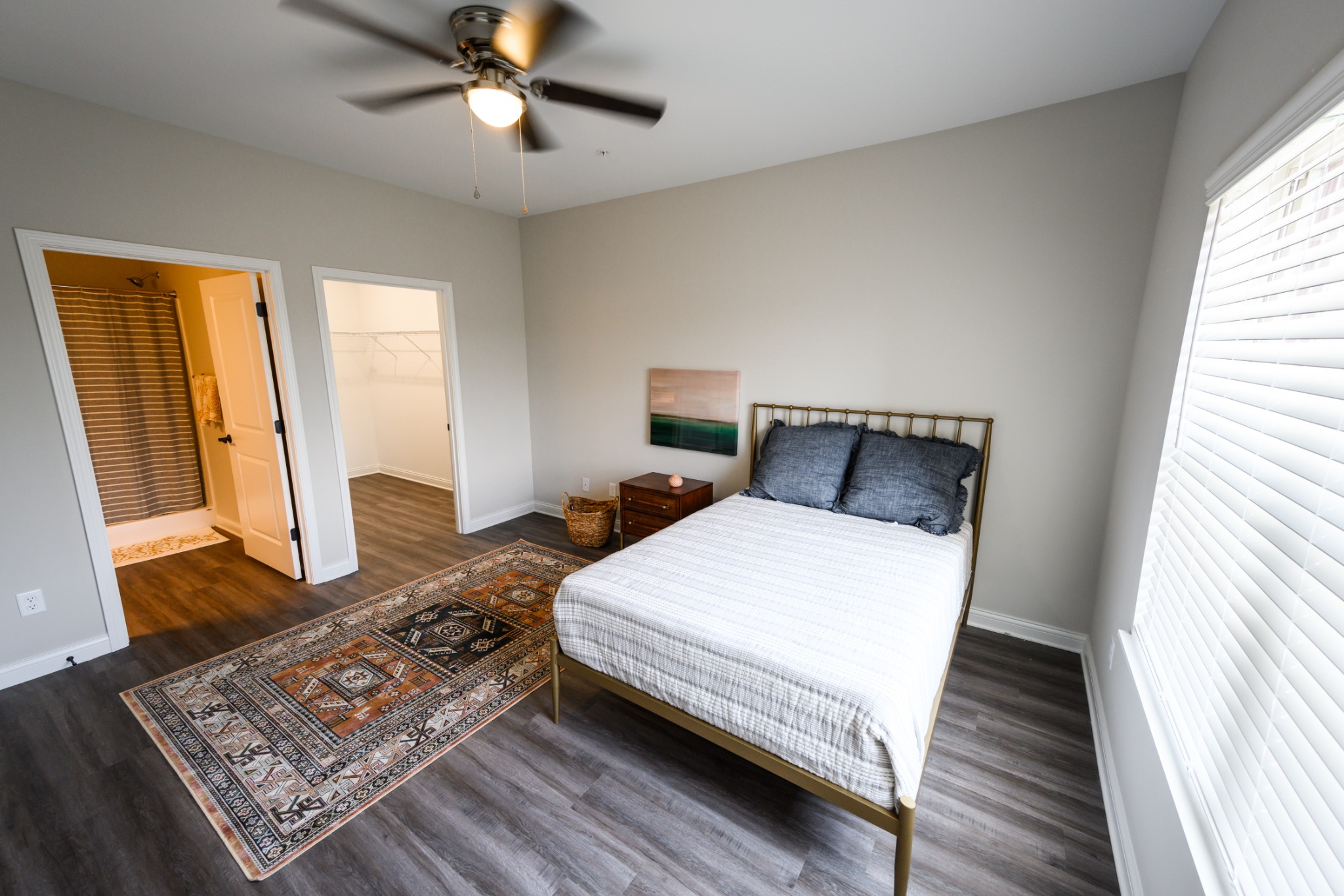 Plum Ridge primary bedroom with ensuite bathroom and walk-in closet