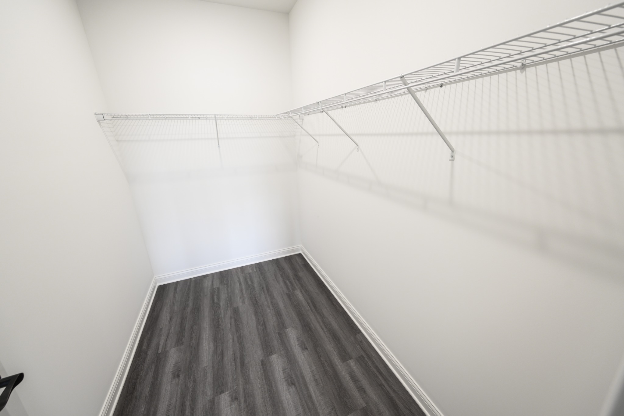 Large walk-in closet with wraparound shelving